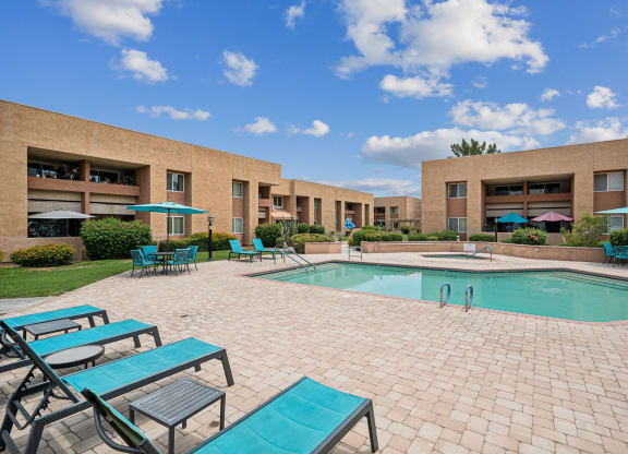 our apartments offer a swimming pool with chairs and umbrellas