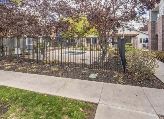 our apartments have a yard with a fence and a swimming pool