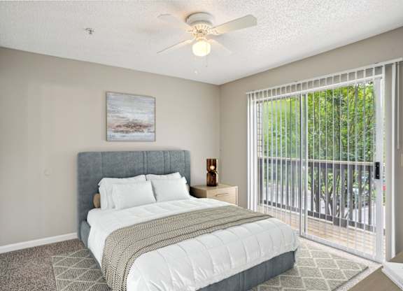 A bedroom with a bed, nightstand, and a painting on the wall.