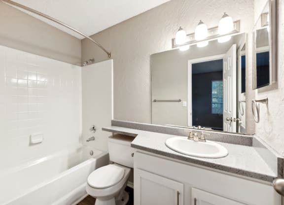the preserve at ballantyne commons apartment bathroom with tub and sink
