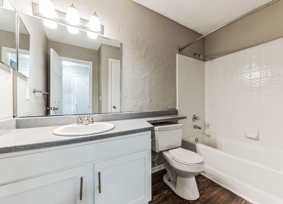 an empty bathroom with a toilet and a sink