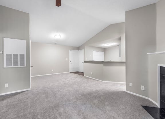 the living room and kitchen in a new home