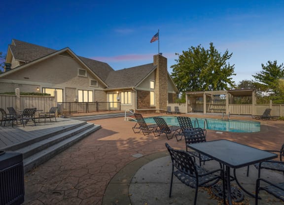 our apartments have a large pool and patio with furniture