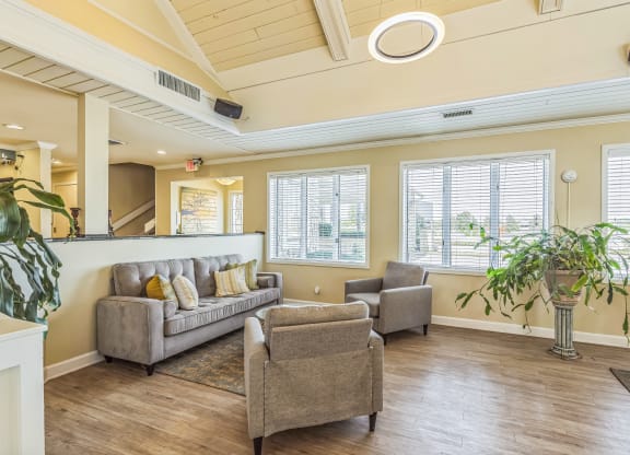a living room with a couch and two chairs