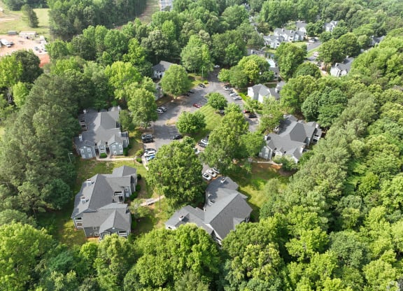 an aerial view of a neighborhood with houses and trees