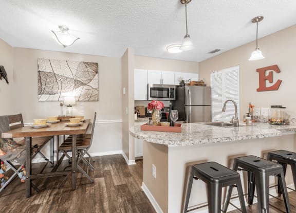 our redesigned kitchen and dining area is open to the living room and family room