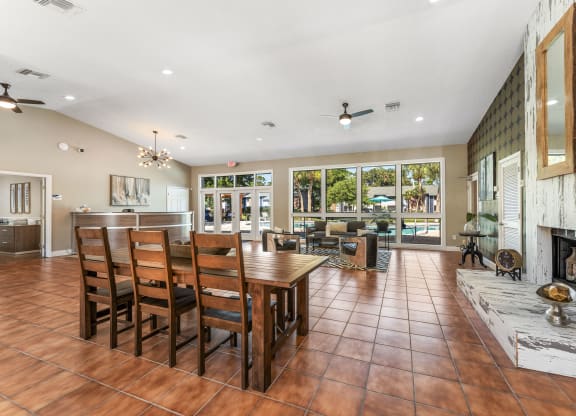 a dining room with a table and chairs and a fireplace