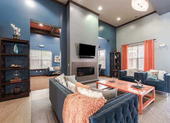 a living room with blue walls and a fireplace