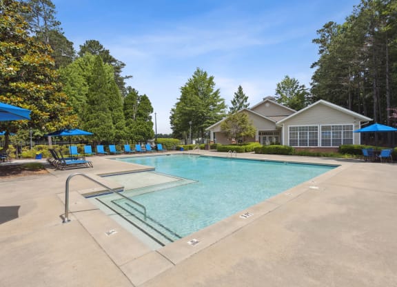 the preserve at ballantyne commons pool with house and trees