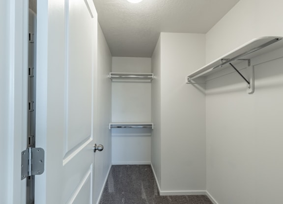 a spacious walk in closet in a 555 waverly unit