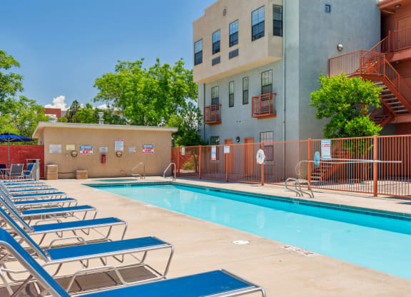 our apartments have a large swimming pool with lounge chairs