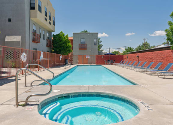 A small pool with a ladder in front of a building.