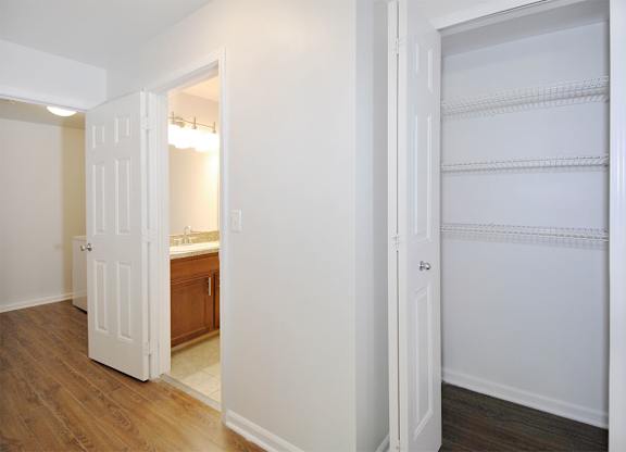 Hallway showing the linen closet entry and the bathroom entry.