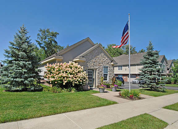 Leasing office entry, with a flagpole in the front area.