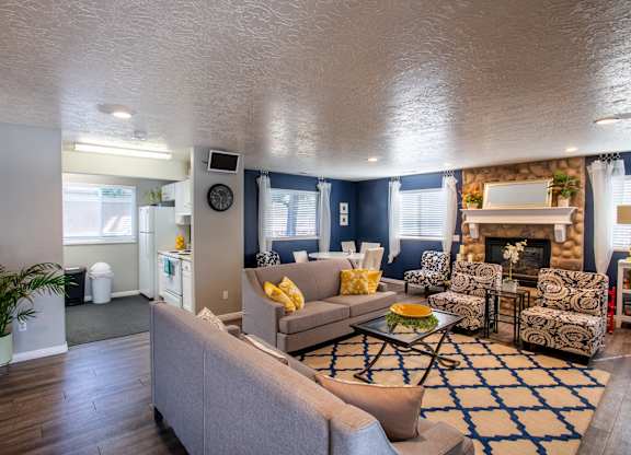 A living room with a grey couch and a coffee table.