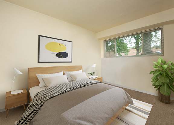 Bedroom with large windows at Cardiff Hall Apartments, Towson