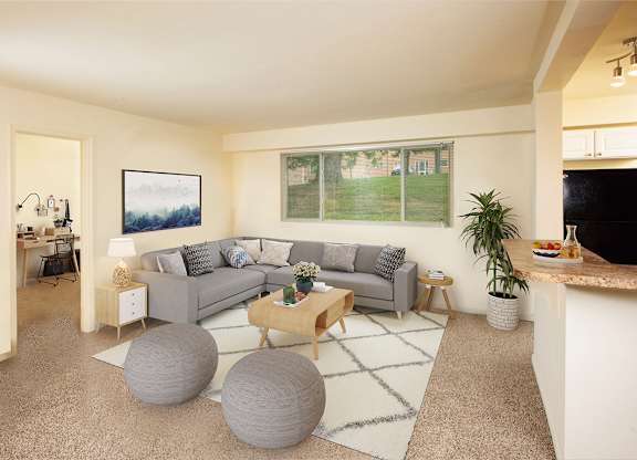 Living room with large windows  at Cardiff Hall Apartments, Maryland