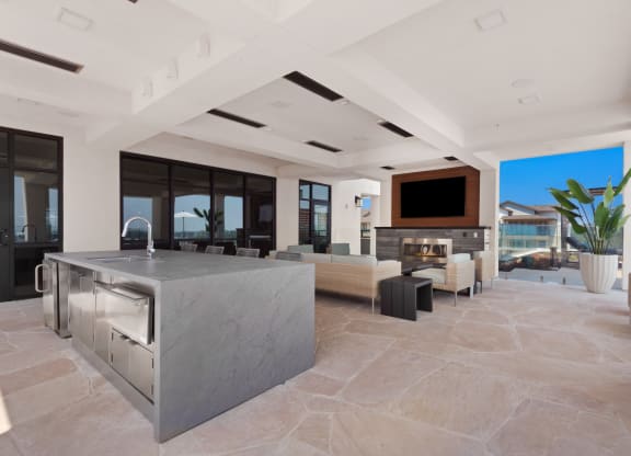 a kitchen with a large island in the middle of a living room