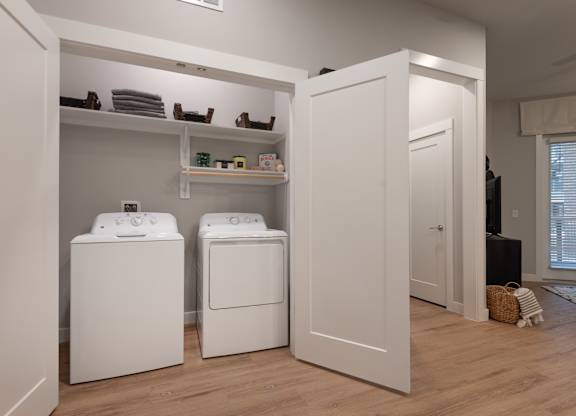 A laundry room with a washer and dryer.