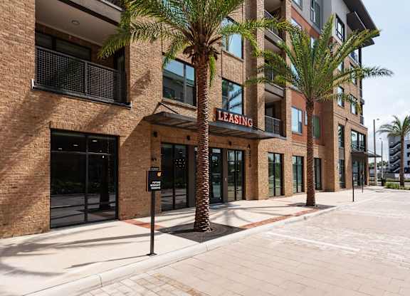 A building with a sign that says "Leasing" is shown.