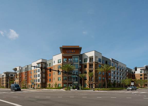 A modern apartment complex with a variety of colors on the buildings.