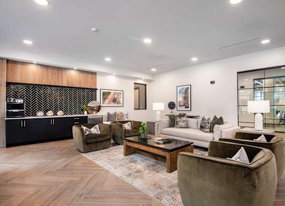 A modern living room with a wooden floor and furniture.