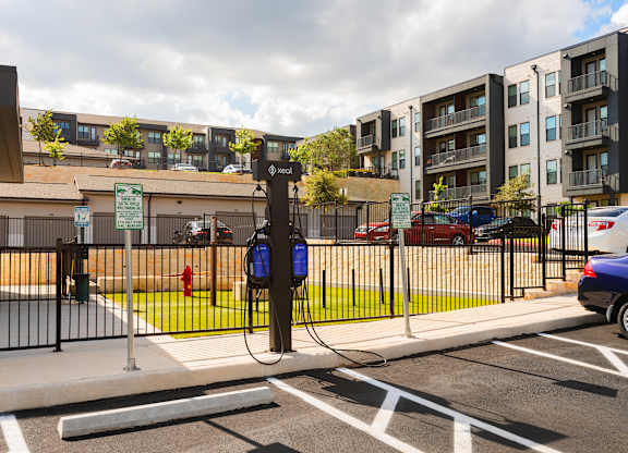 A parking lot with a charging station for electric vehicles.