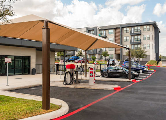 A parking lot with a charging station for electric vehicles.