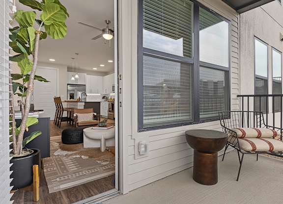 A patio with a table and chairs is shown.