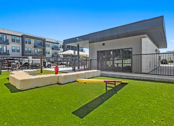 A modern building with a playground in front.