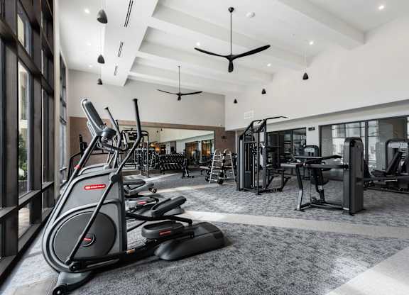 a gym with treadmills and other exercise equipment