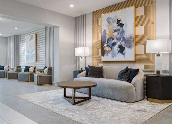 a living room filled with furniture and a large window