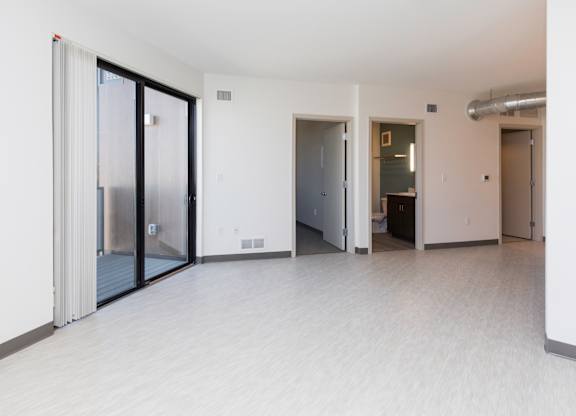 Spacious living room with neutral walls and ample natural light.