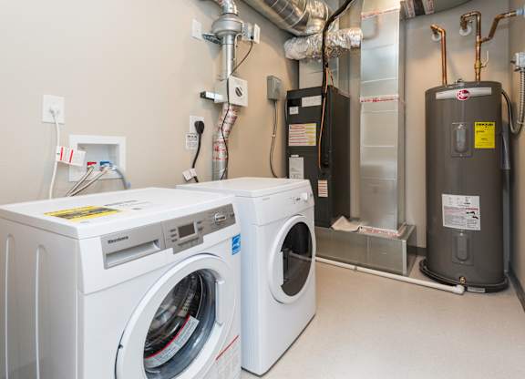 spacious laundry room with storage space