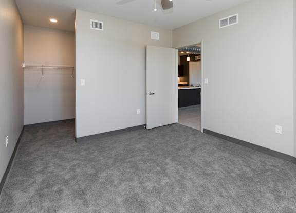 Spacious living room with neutral walls and ample natural light.