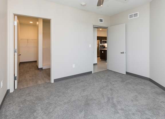 Spacious living room with neutral walls and ample natural light.