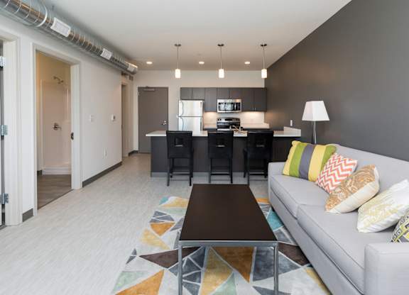 Spacious living room with neutral walls and ample natural light.