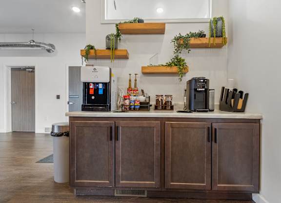 A kitchen with brown cabinets and a white countertop.