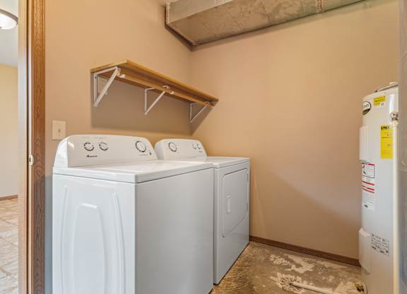 A laundry room with a washer and dryer.