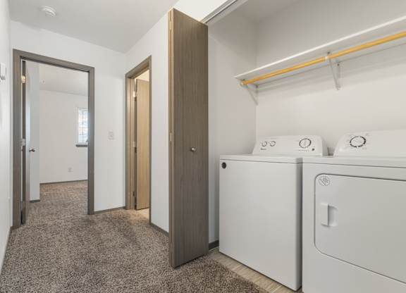 A laundry room with a washer and dryer.