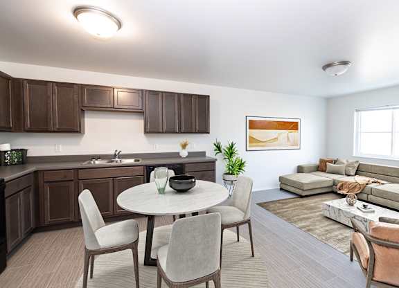 A modern kitchen with a dining table and chairs.