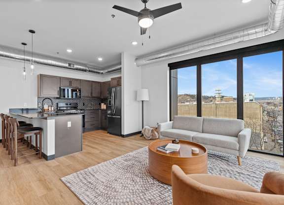 A modern kitchen with a dining table and chairs.