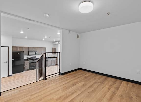 A room with wooden floors and white walls.