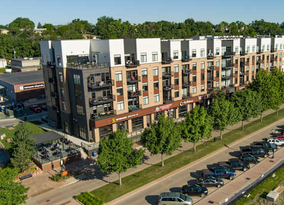 an aerial view of a building with a parking lot