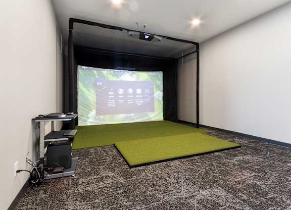 A projection room with a screen and a projector.
