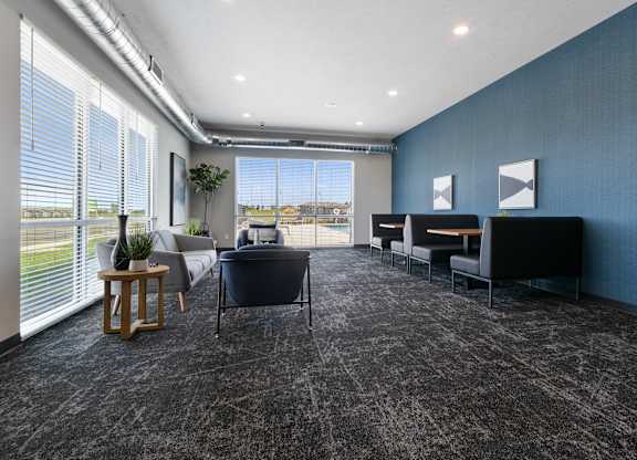 A room with grey carpet and blue walls.