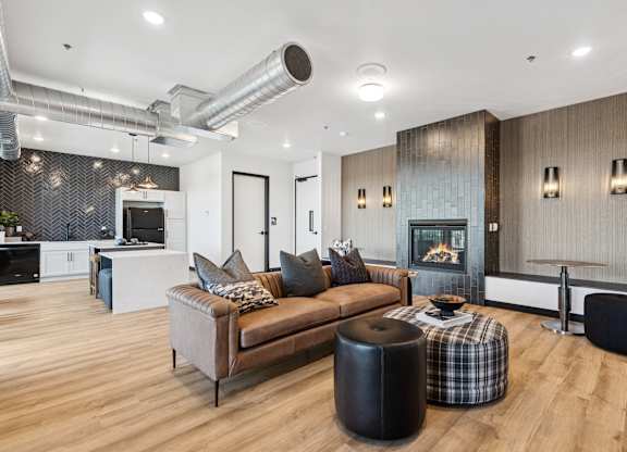 A modern living room with a fireplace and a couch.