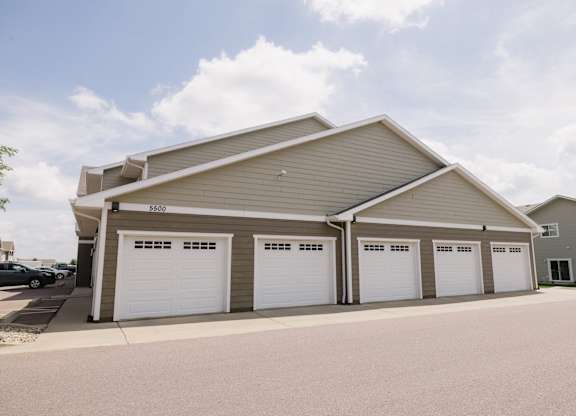 A large garage with four doors is numbered 2980.