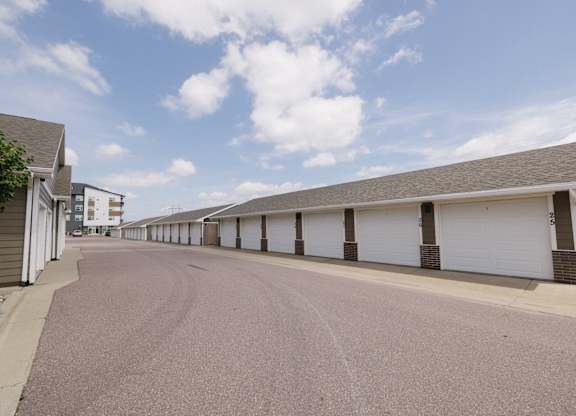 A long row of garage doors are closed.