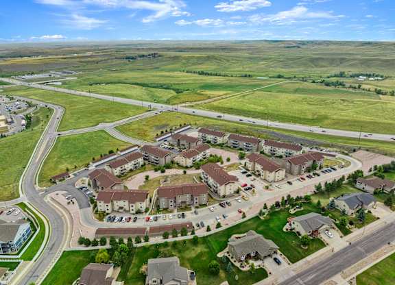 A bird's eye view of a residential area with houses and roads.